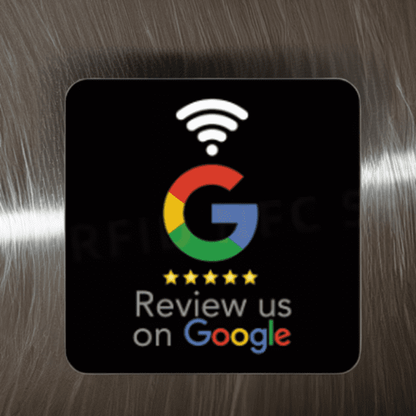 A sign with a metallic background displays the Google logo with five stars beneath it, followed by the text "Review us on Google." Above the logo is an icon representing a Wi-Fi signal.