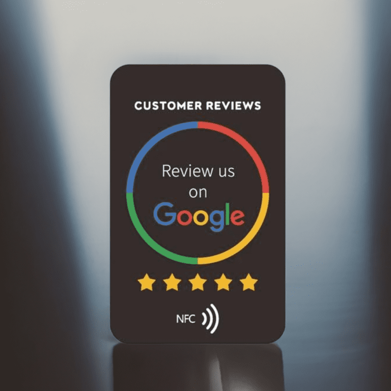 A black sign invites customers to review the business on Google. It features a Google logo encircled by a multi-colored ring and "Customer Reviews" written above. Below, there are five yellow stars and an NFC station for contactless payments. The sleek design makes it look like a Google Review card.